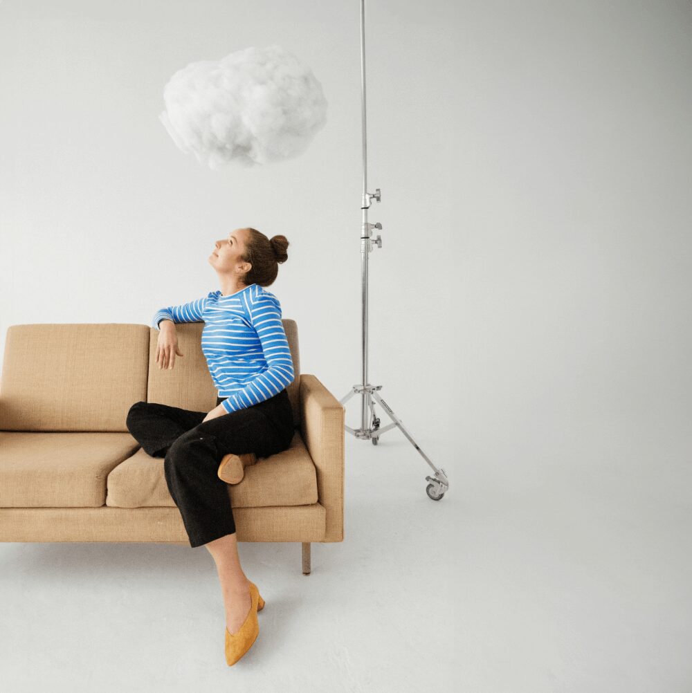 Cecelia - Sitting on a couch looking up at a cloud