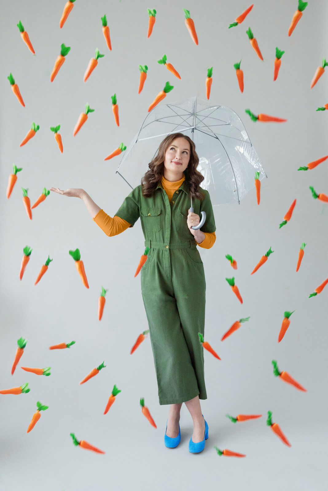 Cecelia under umbrella raining carrots